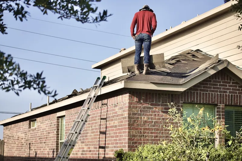 Professional roofer working on a residential roof in Bahama View